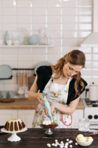 woman baking cake, woman baking bread, woman baking artist, woman baking bread painting